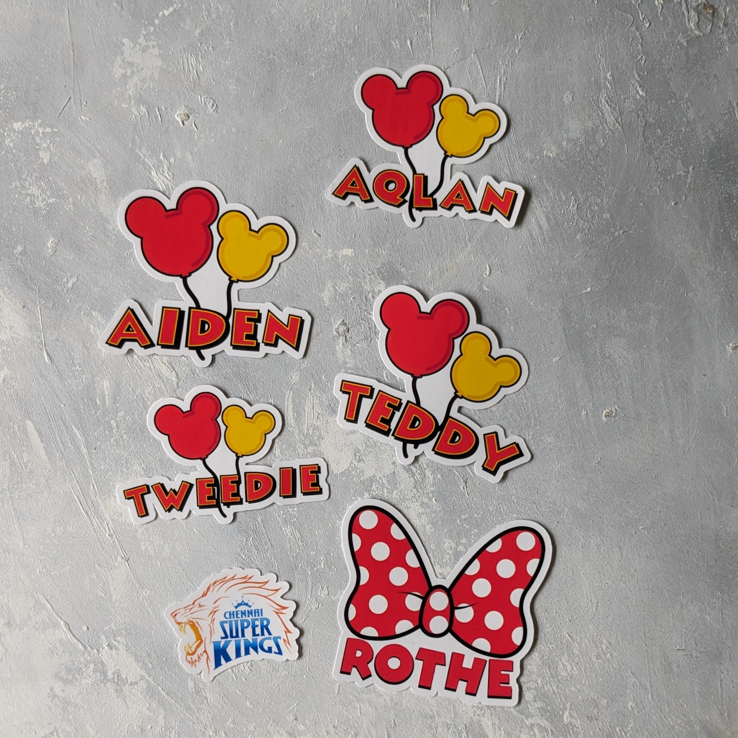 mickey themed baloon mouse labels in thename of aqlan aiden teddy tweedie - part of an order of minnie labels with the name of rothe and CSK logo label