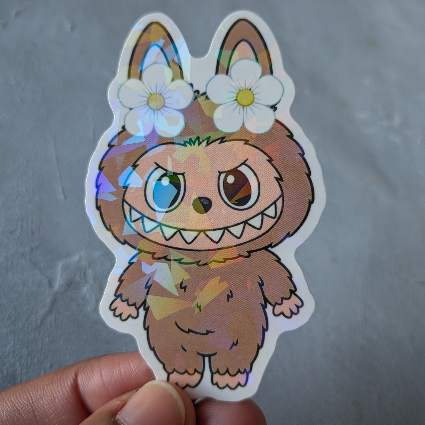 brown monster doll holo sticker
