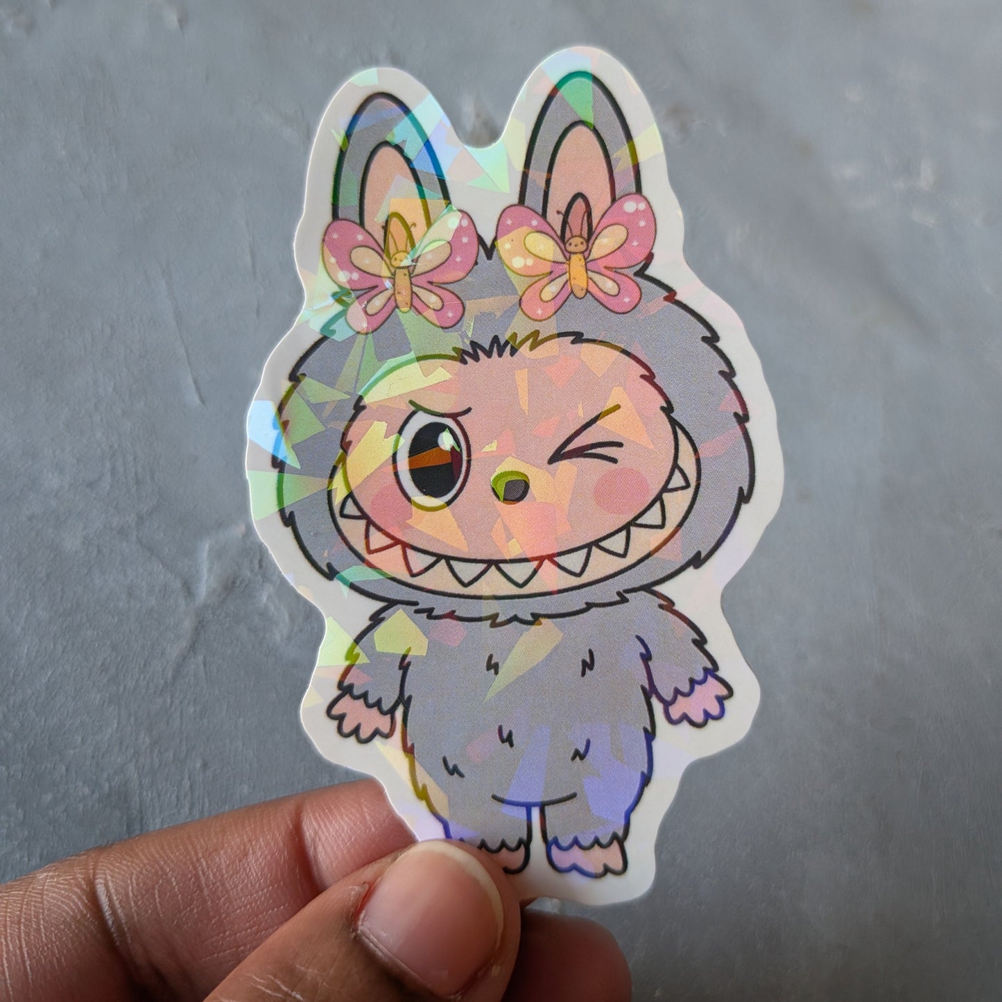 grey monster doll holo sticker
