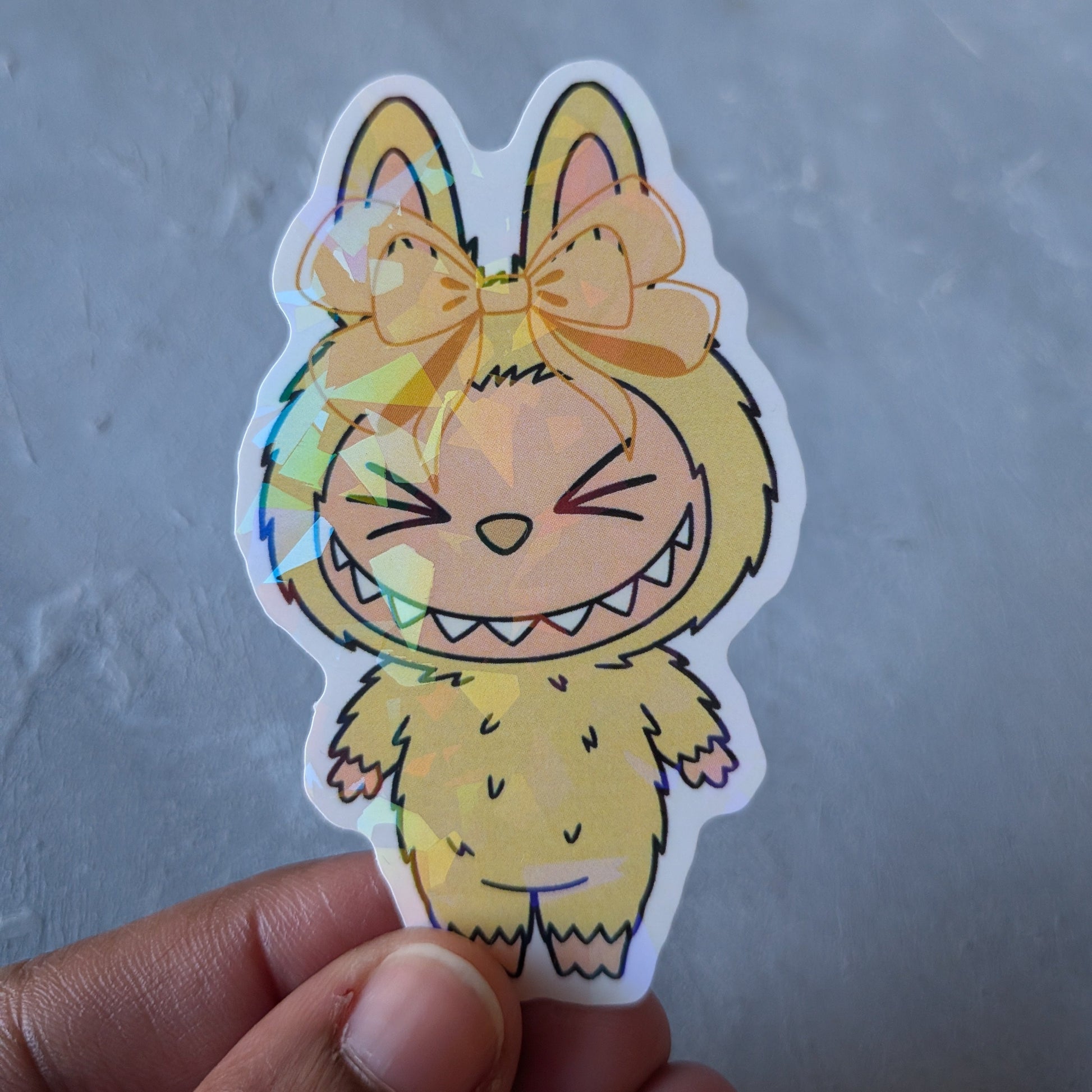 yellow monster doll holo sticker
